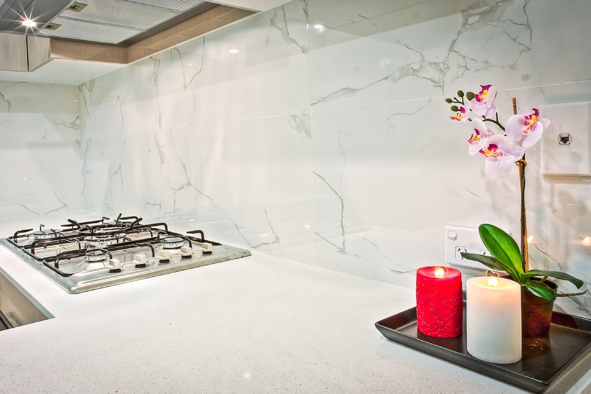Kitchen with marble Countertop with flower and candle decor